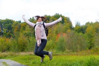 A fit and healthy lifestyle, woman jumping for joy
