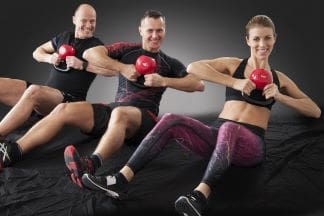 A Fit and Healthy Lifestyle People using kettlebells to exercise