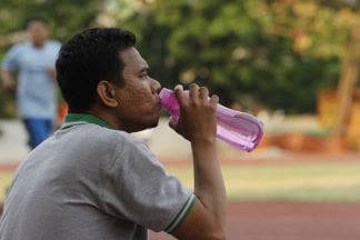 A Fit and Healthy Lifestyle man-drinking-water