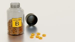 Motivational Supplements Open bottle of vitamin-b