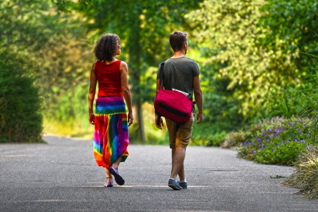 Picture of a couple walking in nature. Walking Daily Benefits