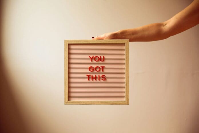 Picture of a person holding a sign that says 