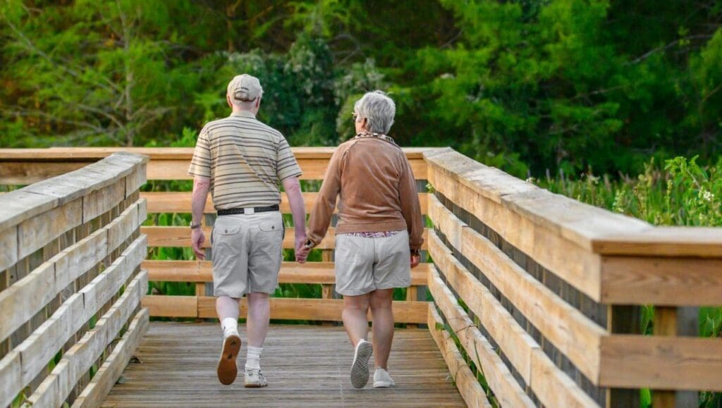 Picture of a older couple out walking. Best Exercises and Worst Exercises for People Over 65