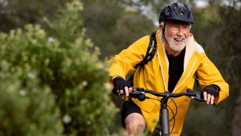 Picture of an older man biking. exercise for older adults