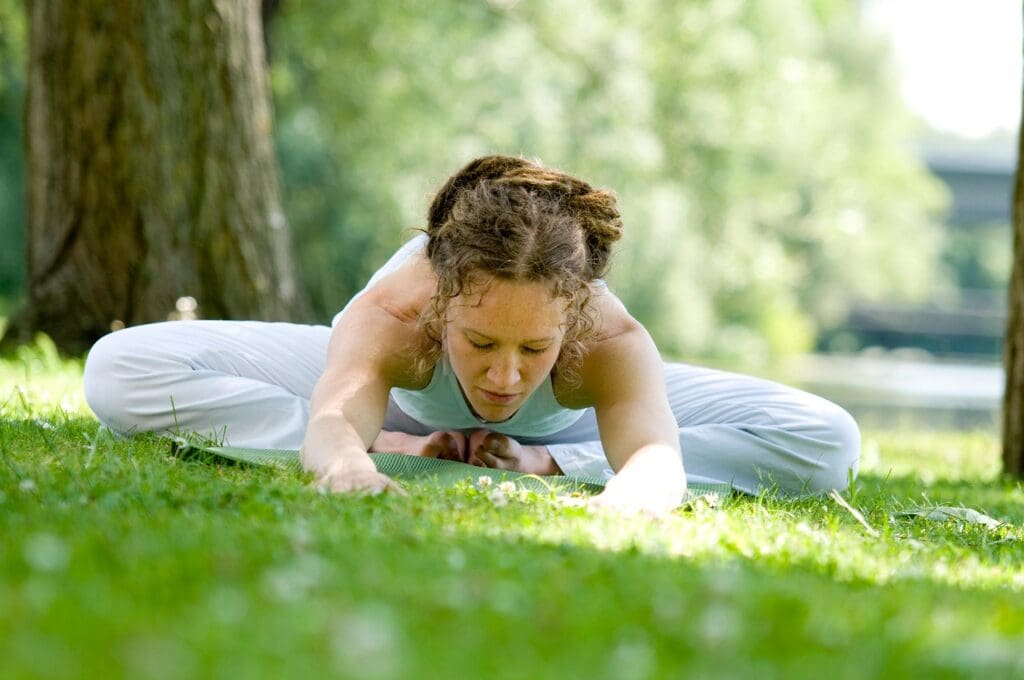 Picture of a woman doing yoga. Strengthen Your Core, improving balance