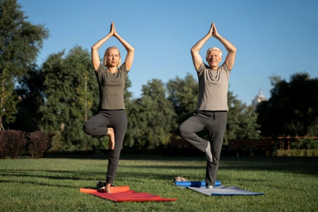 Picture of a woman and man doing yoga. Strengthen Your Core, improving balance