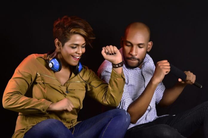 Picture of a couple enjoying music. What is Intrinsic Motivation