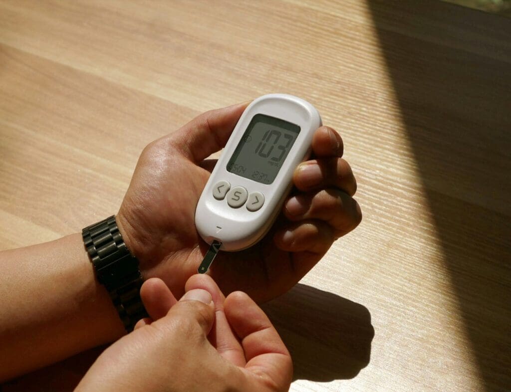 Picture of a man using a diabetes tester. How Processed Foods are Bad for You