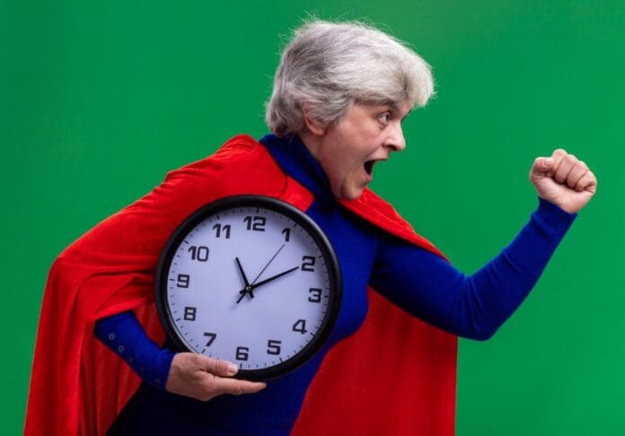 Picture of a older woman in a superman outfit. Motivation After 60 to Stay Active. How to live a more active lifestyle.