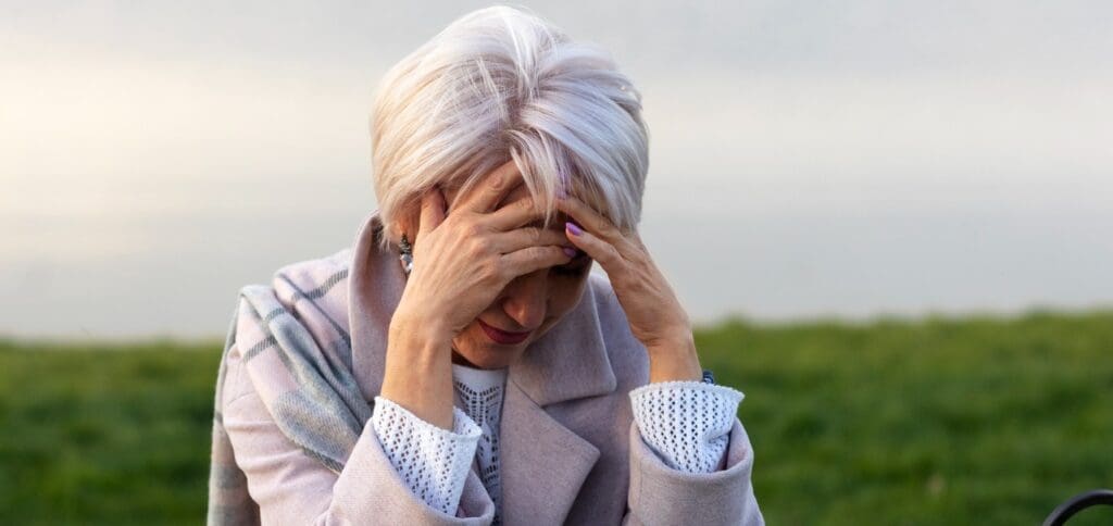 Picture of a woman with stress and anxiety. Daily Multivitamins for Women Over 60