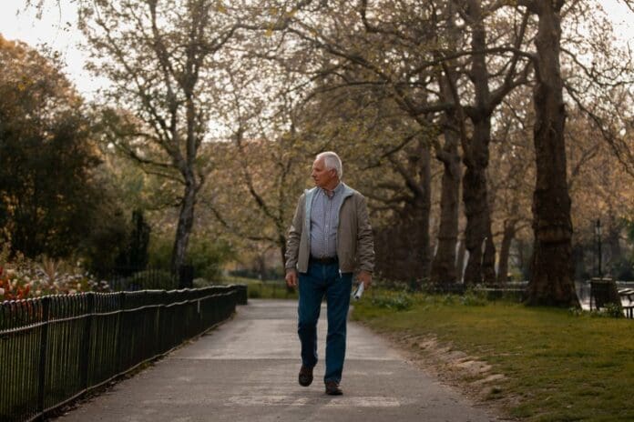 Older man walking in the park. Men Over 50 Beyond The Gym